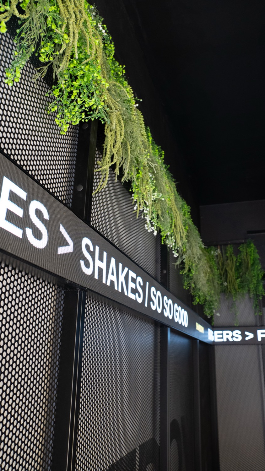 The ticker angled away along the feature wall past the planting